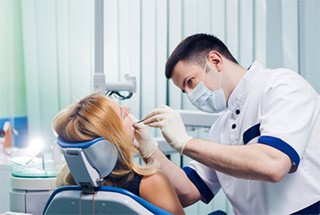 Dentist conducting dental checkup