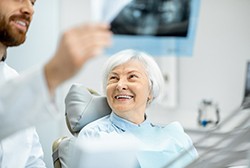 patient smiling while visiting dentist for consultation 