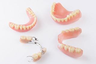 Partial and full dentures on table top